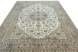 Surface texture of 2000s Kashan rug with natural Wool and intricate pattern