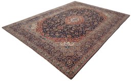 Corner detail of 2000s Kashan rug showing border pattern and Wool pile