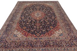 Surface texture of 2000s Kashan rug with natural Wool and intricate pattern