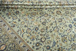 Close-up detail of 2000s Kashan rug from Iran / Persia showing Wool weave