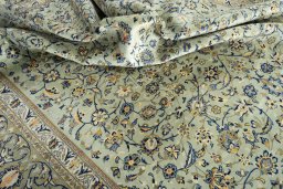 Surface texture of 2000s Kashan rug with natural Wool and intricate pattern
