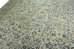 Backside of handmade 2000s Kashan rug showing knot structure and weave density