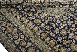 Close-up detail of 2000s Kashan rug from Iran / Persia showing Wool weave
