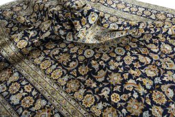 Surface texture of 2000s Kashan rug with natural Wool and intricate pattern