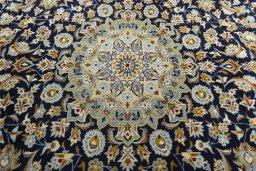 Central medallion detail of 2000s Kashan rug from Iran / Persia