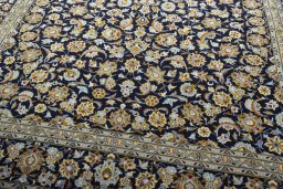 Close-up detail of 2000s Kashan rug from Iran / Persia showing Wool weave
