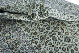 Surface texture of 2000s Kashan rug with natural Wool and intricate pattern
