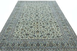 Surface texture of 2000s Kashan rug with natural Wool and intricate pattern