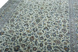 Backside of handmade 2000s Kashan rug showing knot structure and weave density