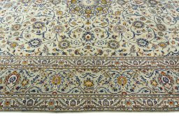 Corner detail of 2000s Kashan rug showing border pattern and Wool pile