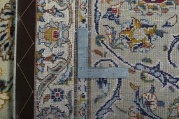 Backside of handmade 2000s Kashan rug showing knot structure and weave density