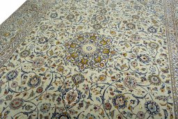 Backside of handmade 2000s Kashan rug showing knot structure and weave density