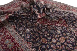 Surface texture of 2000s Kashan rug with natural Wool and intricate pattern