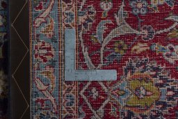 Backside of handmade 2000s Kashan rug showing knot structure and weave density