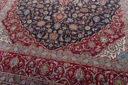 Close-up detail of 2000s Kashan rug from Iran / Persia showing Wool weave