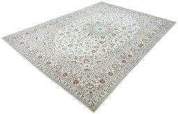 Corner detail of 2000s Kashan rug showing border pattern and Wool pile