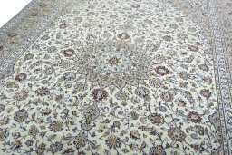 Backside of handmade 2000s Kashan rug showing knot structure and weave density