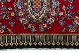Backside of handmade New Kashan rug showing knot structure and weave density