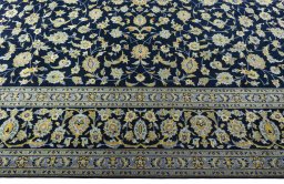Corner detail of 1970s Kashan rug showing border pattern and Wool pile