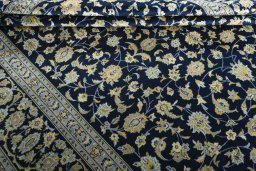Close-up detail of 1970s Kashan rug from Iran / Persia showing Wool weave