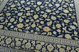 Close-up detail of 1970s Kashan rug from Iran / Persia showing Wool weave