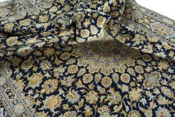 Surface texture of 2000s Kashan rug with natural Wool and intricate pattern