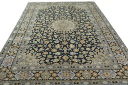 Surface texture of 2000s Kashan rug with natural Wool and intricate pattern