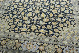 Close-up detail of 2000s Kashan rug from Iran / Persia showing Wool weave
