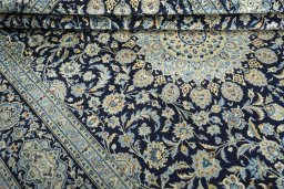 Close-up detail of 2000s Kashan rug from Iran / Persia showing Wool weave