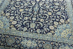 Close-up detail of 2000s Kashan rug from Iran / Persia showing Wool weave