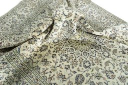 Surface texture of 2000s Kashan rug with natural Wool and intricate pattern