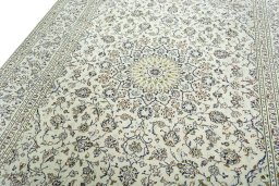 Backside of handmade 2000s Kashan rug showing knot structure and weave density