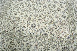 Close-up detail of 2000s Kashan rug from Iran / Persia showing Wool weave