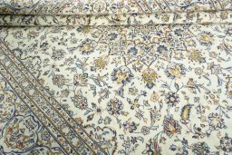 Close-up detail of 2000s Kashan rug from Iran / Persia showing Wool weave