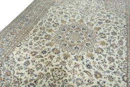 Backside of handmade 2000s Kashan rug showing knot structure and weave density