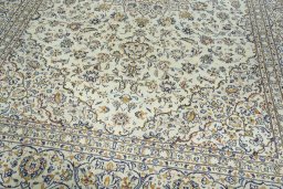 Close-up detail of 2000s Kashan rug from Iran / Persia showing Wool weave