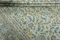 Close-up detail of 2000s Kashan rug from Iran / Persia showing Wool weave