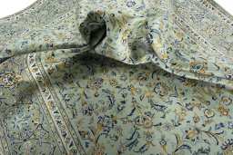 Surface texture of 2000s Kashan rug with natural Wool and intricate pattern
