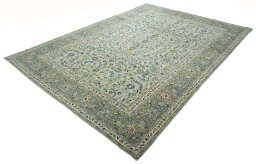 Corner detail of 2000s Kashan rug showing border pattern and Wool pile
