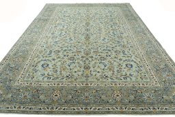 Surface texture of 2000s Kashan rug with natural Wool and intricate pattern