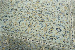 Close-up detail of 2000s Kashan rug from Iran / Persia showing Wool weave
