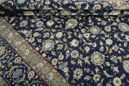Close-up detail of 2000s Kashan rug from Iran / Persia showing Wool weave