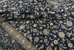 Surface texture of 2000s Kashan rug with natural Wool and intricate pattern