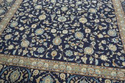 Close-up detail of 2000s Kashan rug from Iran / Persia showing Wool weave