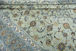 Close-up detail of 2000s Kashan rug from Iran / Persia showing Wool weave