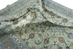 Surface texture of 2000s Kashan rug with natural Wool and intricate pattern