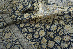 Surface texture of 1970s Kashan rug with natural Wool and intricate pattern