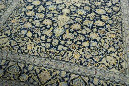 Close-up detail of 1970s Kashan rug from Iran / Persia showing Wool weave