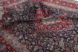 Surface texture of 2000s Kashan rug with natural Wool and intricate pattern