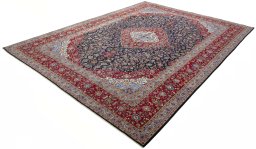 Corner detail of 2000s Kashan rug showing border pattern and Wool pile